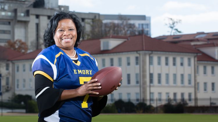 Emory alumna Shan Cooper with football