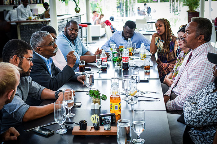 Franklin (right side, center) leads a conversation with Haitian Senator Patrice Dumont (left side, center) during the group's visit to Haiti.