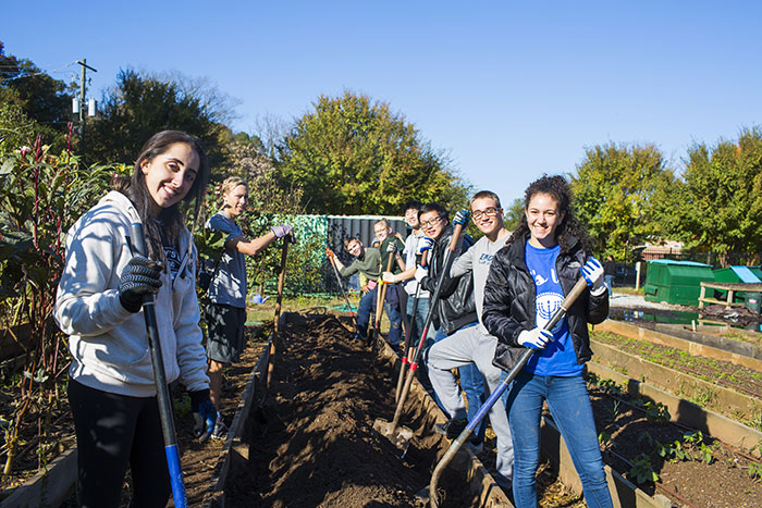 Students tend the garden at Truly Living Well Center