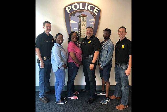 Six Emory Police Department pose in denim for Denim Day.