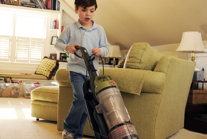 Boy with a vacuum cleaner