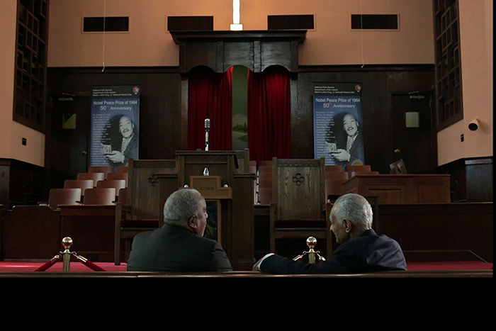 LaFayette (left) talks with fellow civil rights activist Rev. C.T. Vivian at the historic Ebenezer Baptist Church on Auburn Avenue during a filming for the course.