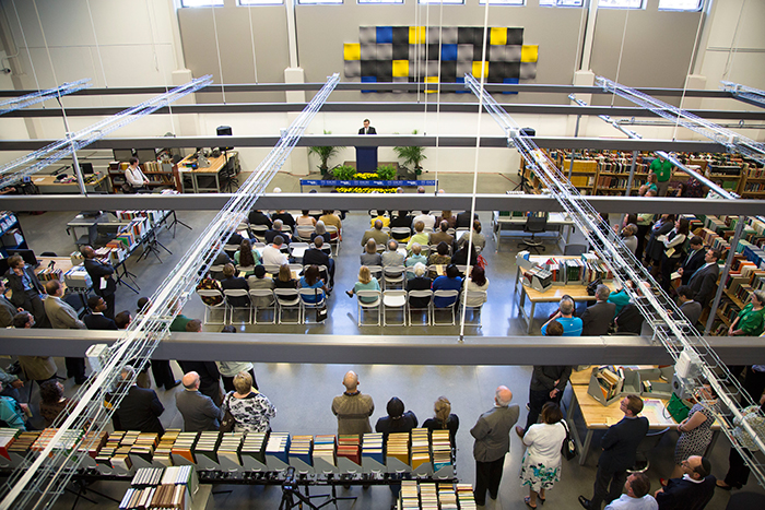 The Library Service Center dedication was held on the floor where books are processed into the center's collections.