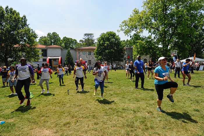 Emory employees dance on the quad