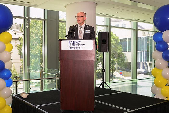 Bryce Gartland, CEO of Emory University Hospital, welcomes a room full of staff to the EUH Tower Open House.