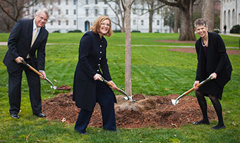 President Sterk, Jimmy Powell and Bobbi Patterson with shovels planting tree