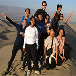 Students posing while studying abroad in a desert