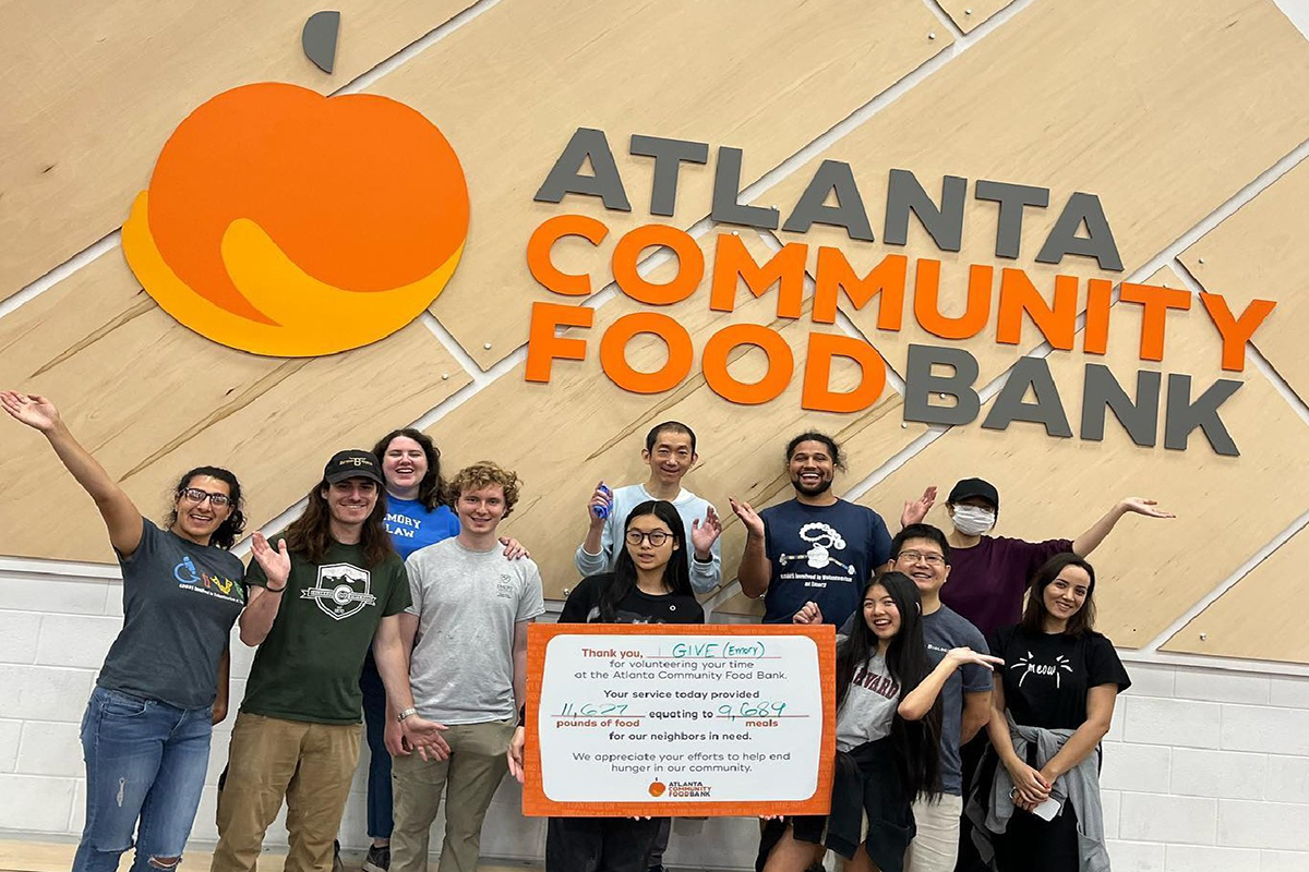 Group of students standing in front of the Atlanta Community Food Bank sign
