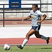 woman kicking soccer ball