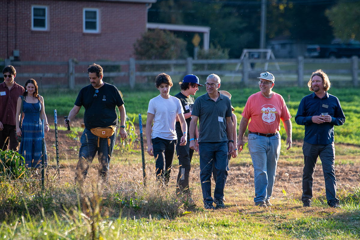 Folks walking near a field