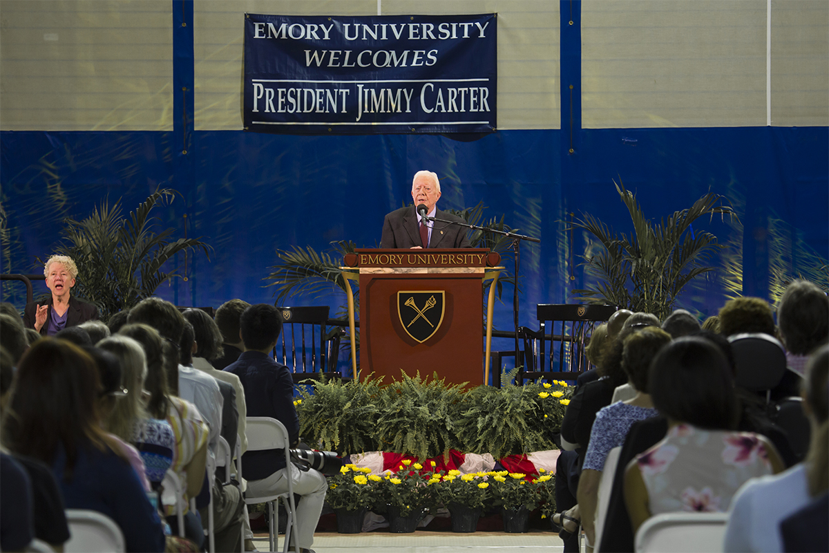 Former President Jimmy Carter speaking to a large crowd of students at Emory University