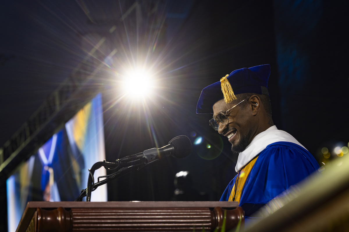 Usher at a podium during Emory University Commencement 2025