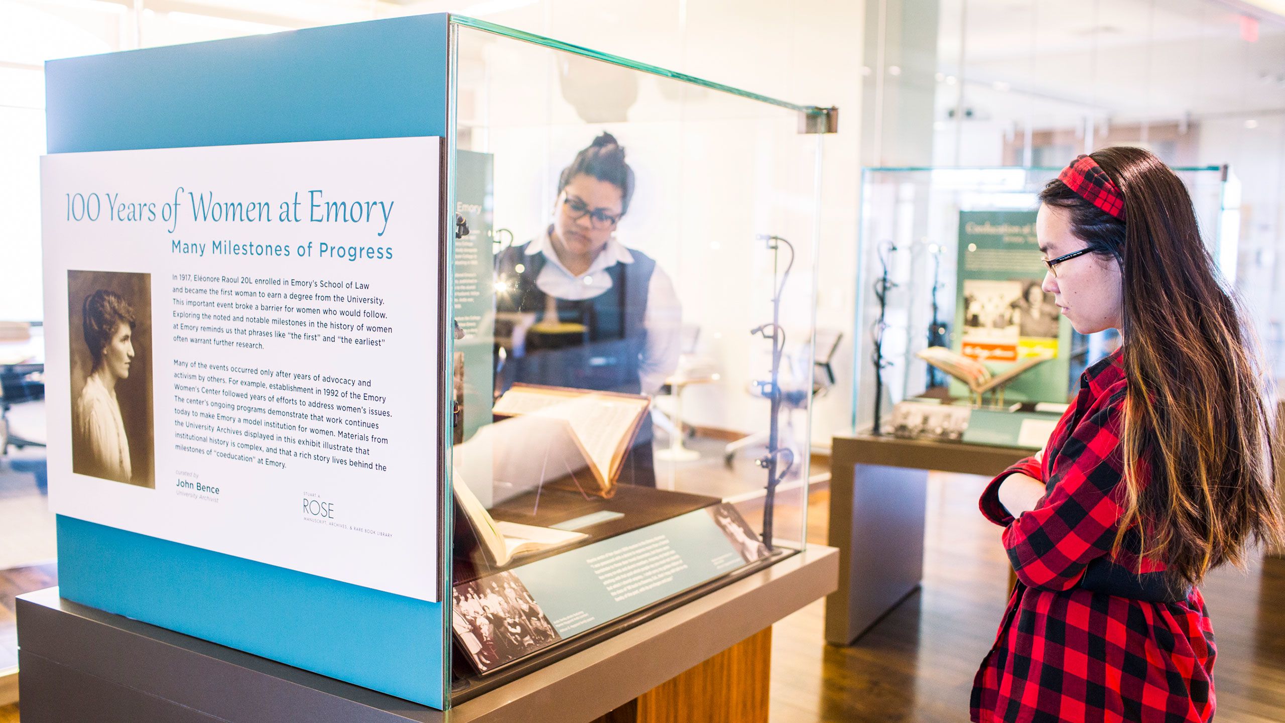 Visitors to Emory's Rose Library view an exhibit on 100 years of women at Emory.