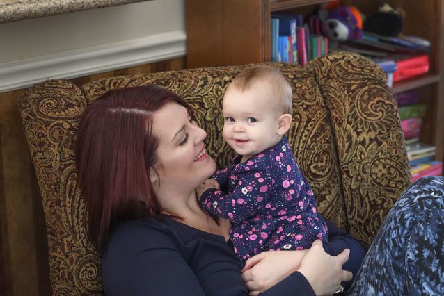 Megan Blay holds her infant daughter, Emma Blay