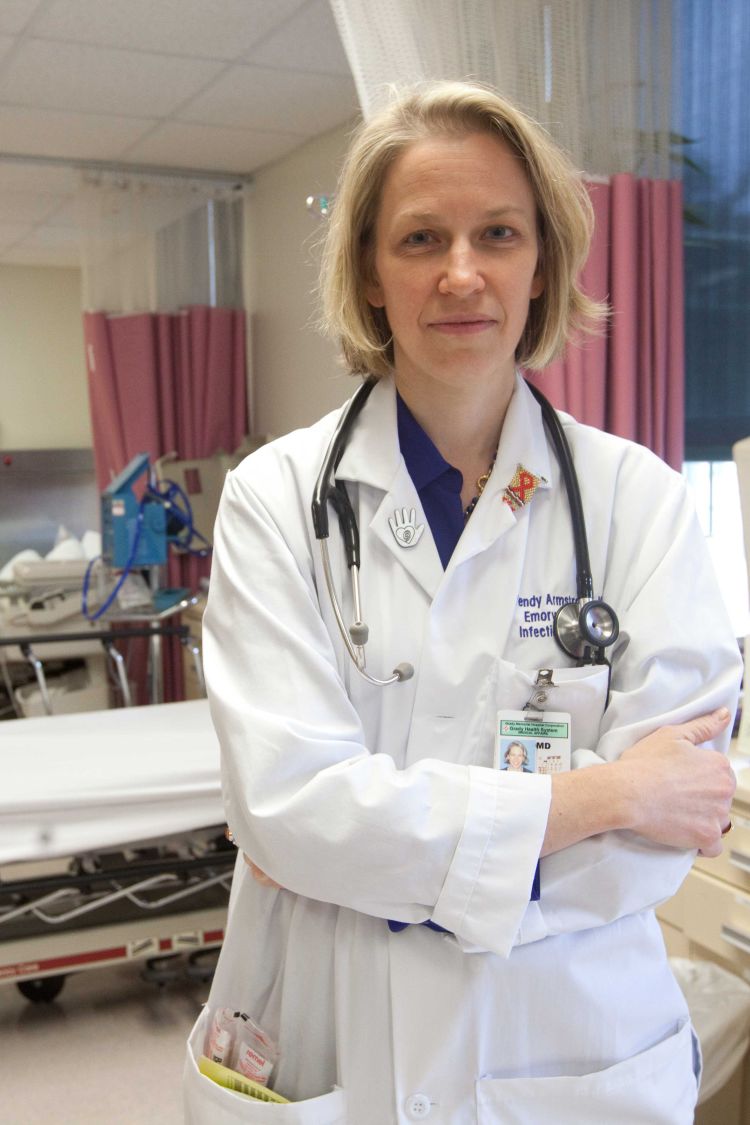 Wendy Armstrong stands in an exam room at the Ponce de Leon Center, where she is director.