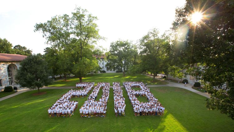 Students wearing white shirts form the numbers 2018 on the Emory Quadrangle.