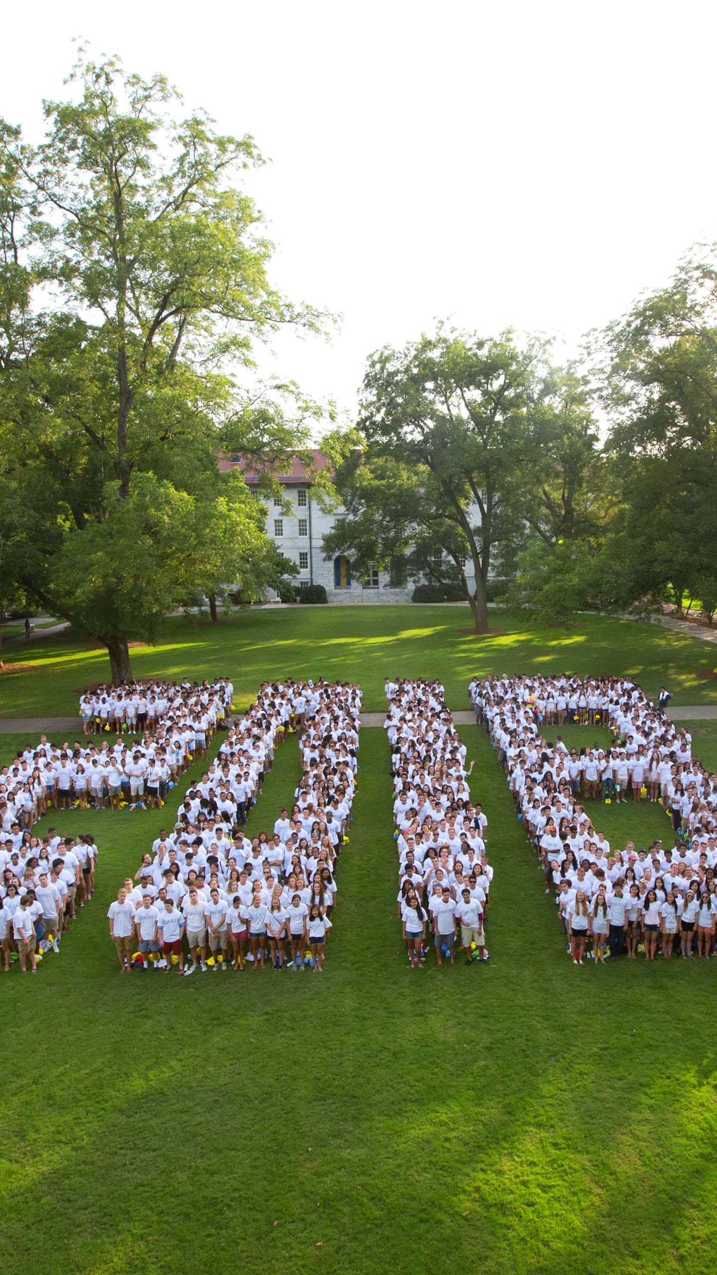 Students wearing white shirts form the numbers 2018 on the Emory Quadrangle.