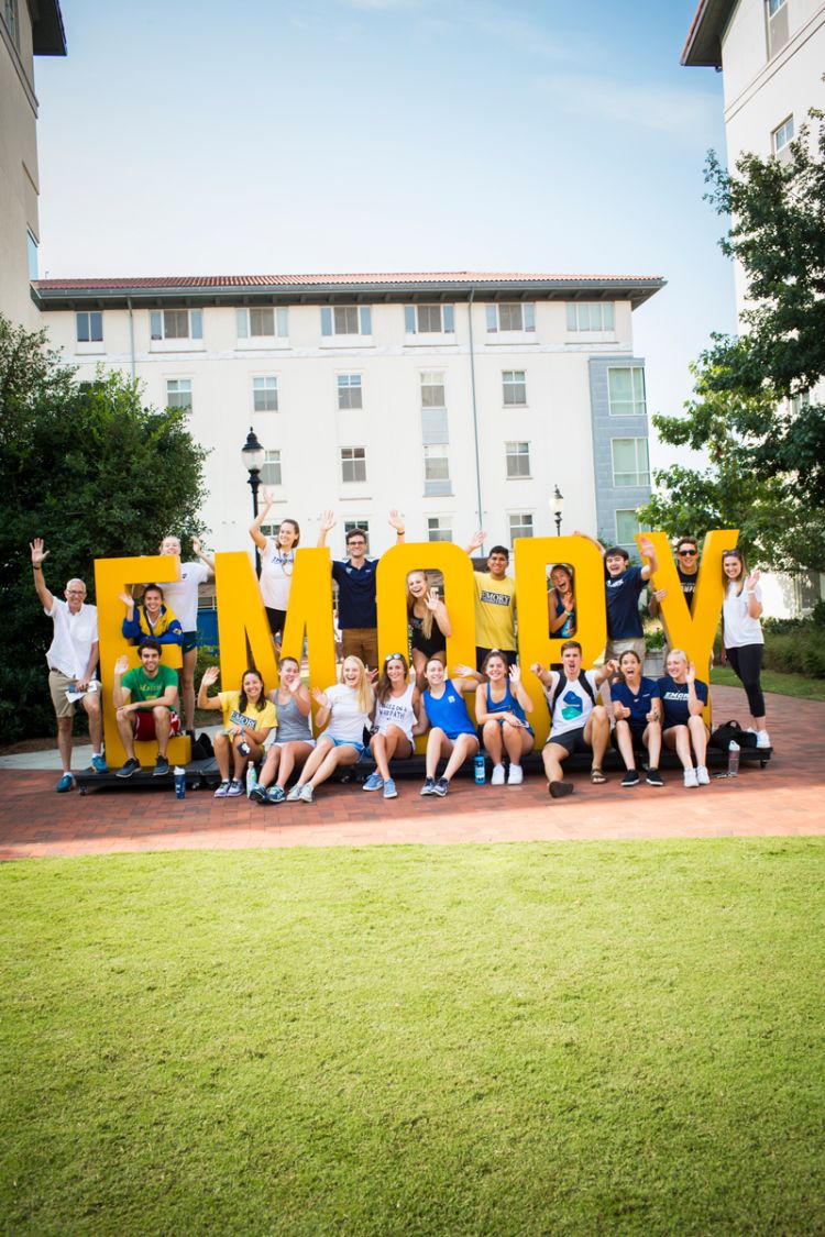 Students pose with giant letters spelling out "Emory."