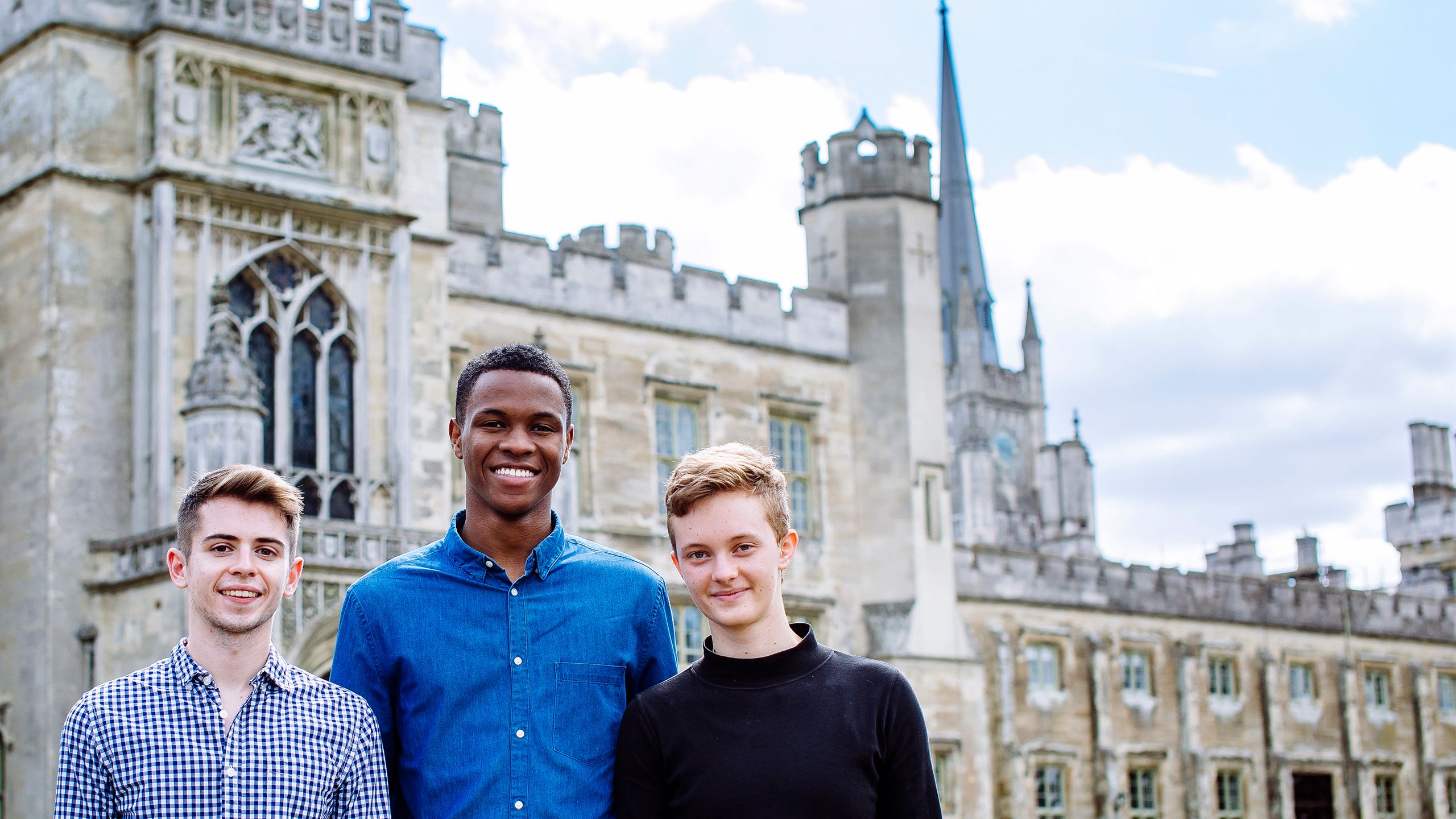 Emory students Kieren Helmn, Ryan James and Jesse Rosen-Gooding pose outside of the English castle where they are competing in the Hult Prize Accelerator.