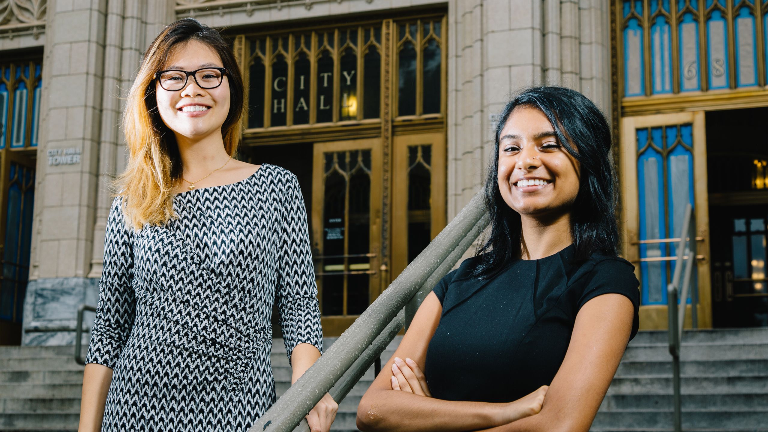 Angela Jiang and Tarunika Anand stand on the front steps of Atlanta City Hall.