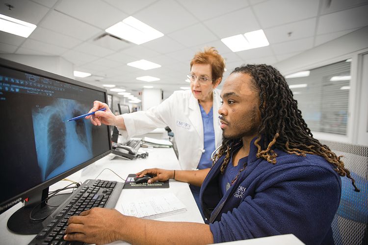 An Emory nursing student with an instructor.