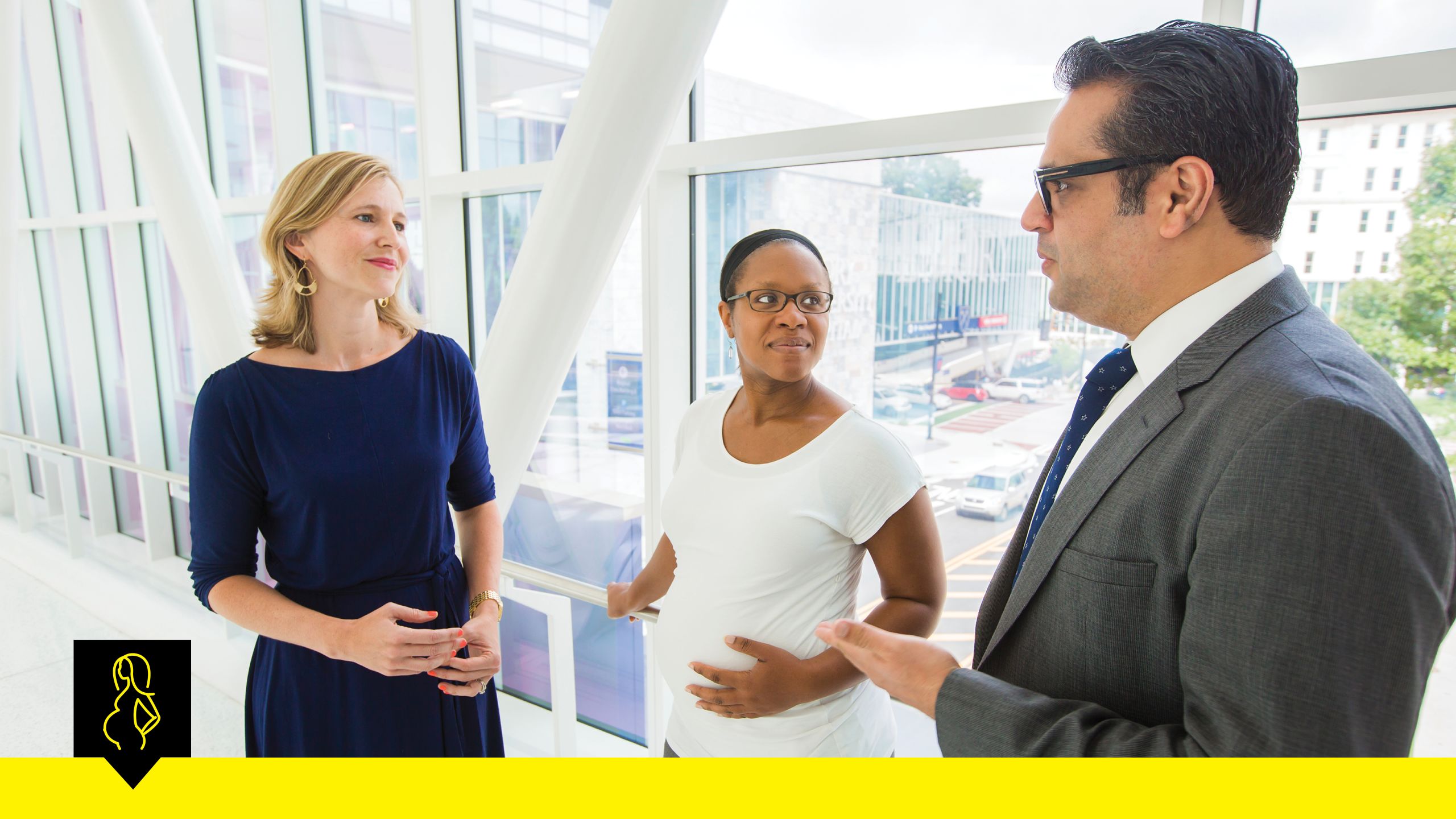 Allison Chamberlain, left, and Saad Omer, right, study the safety and effectiveness of the flu vaccine for pregnant women, who face a high risk of complicaitons if they get the virus. They are pictured here with Shannon Vassell.
