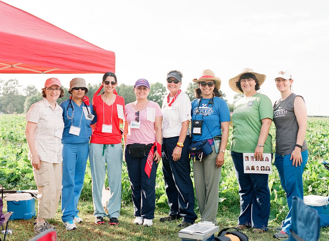 Emory students from the School of Medicine's Physicians Assistant (PA) Program volunteer in a field