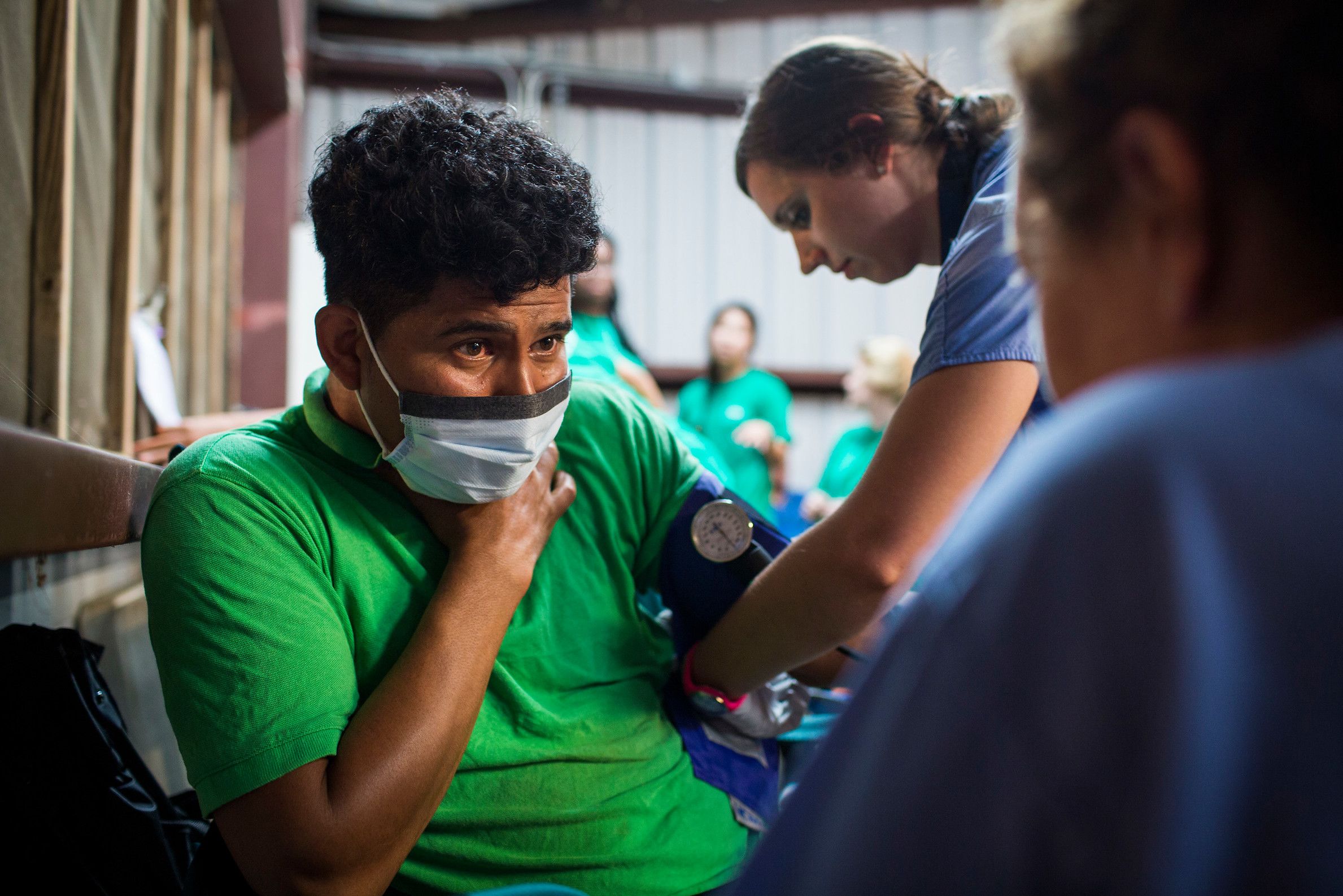 Two Emory nursing students work with a patient