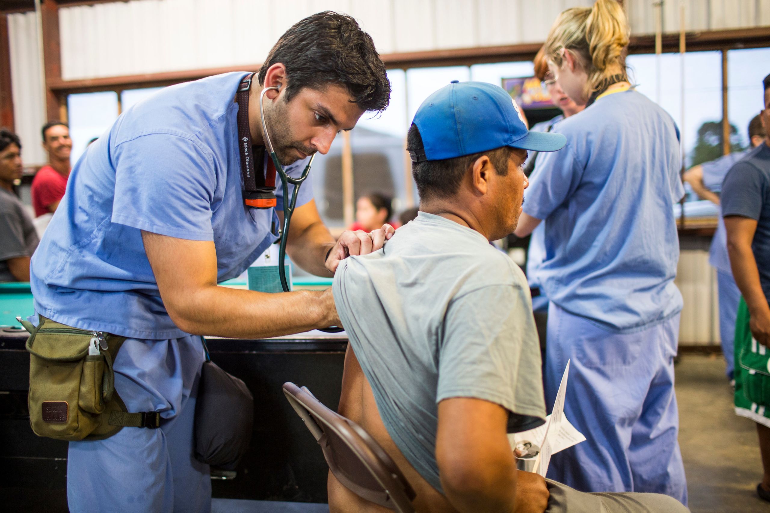 Emory students and faculty work at the night camp at Lewis Taylor Farms