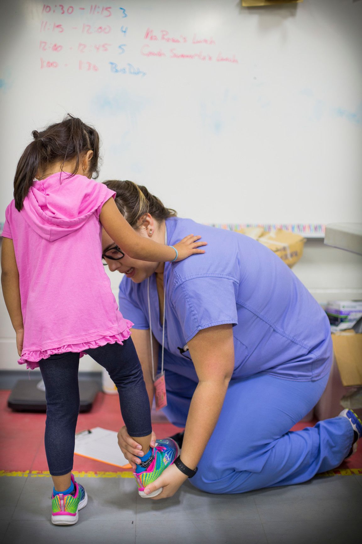 An Emory nursing student works with a Cox Elementary student