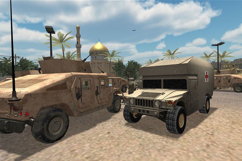 A view of a military ambulance and truck parked together.