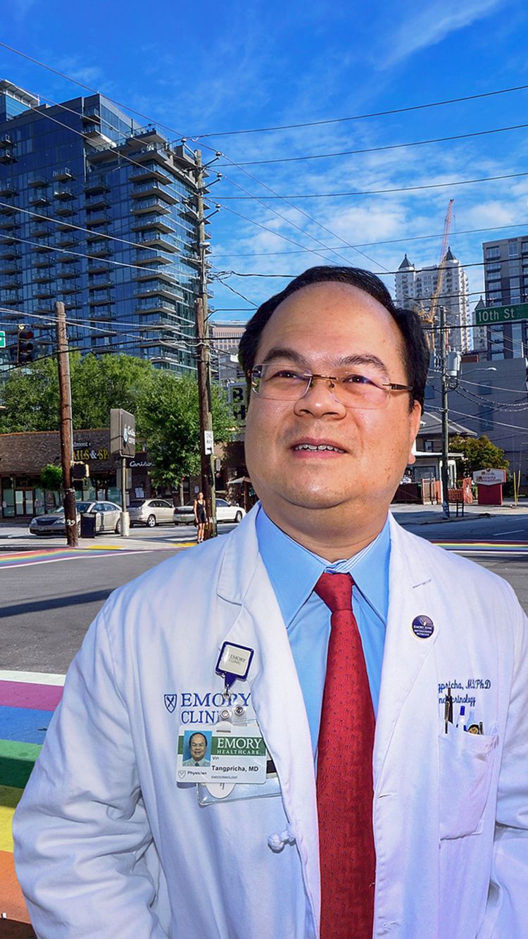 Dr. Doug Murphy ofDr. Vin Tangpricha poses in front of the rainbow crosswalks in midtown Atlanta Emory St. Joseph's Hospital works at an operating table with three others