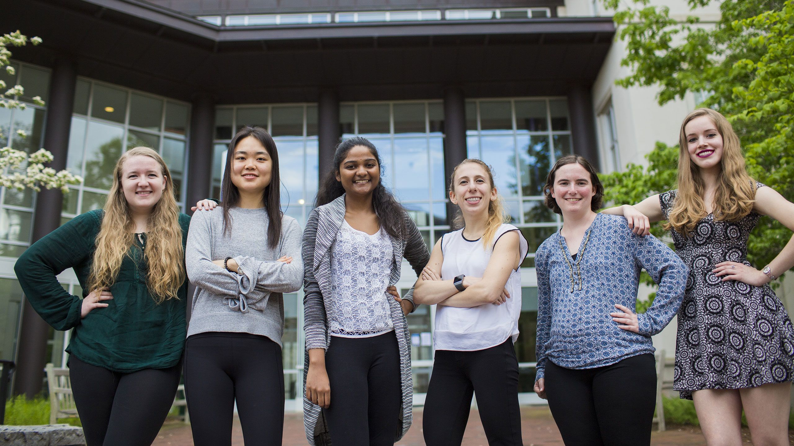 Six seniors who graduated with honors in physics in May stand together proudly