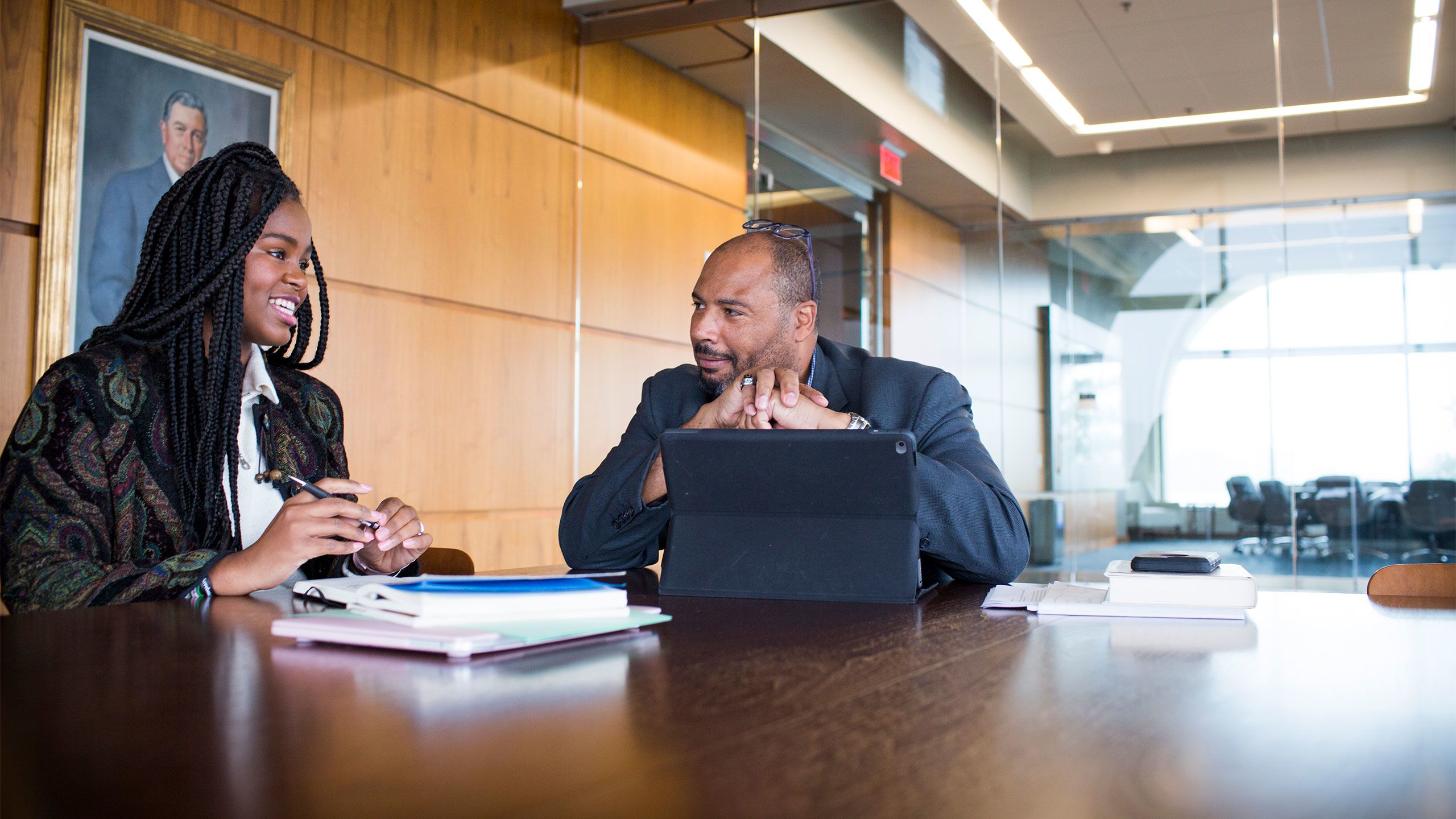 Christell Roach and Pellom McDaniels sit together at a table in Emory's Rose Library.