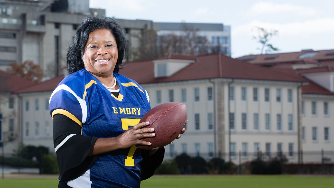 Emory alumna Shan Cooper with football