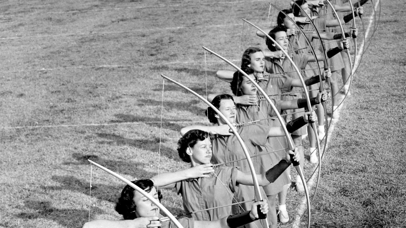 Archival photo of women in archery class