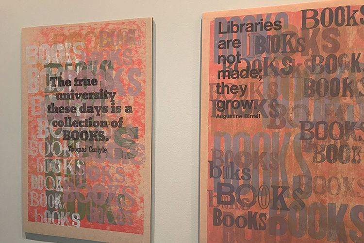 A print by artist Amos P. Kennedy Jr. that reads "the true university these days is a collection of books"