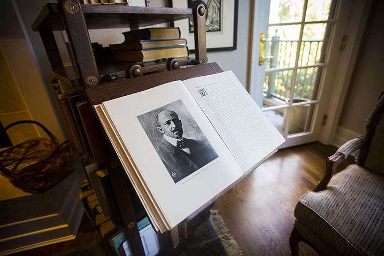The National Cyclopedia of the Colored Race resting open on a stand and displaying a black and white portrait of W.E.B. Du Bois