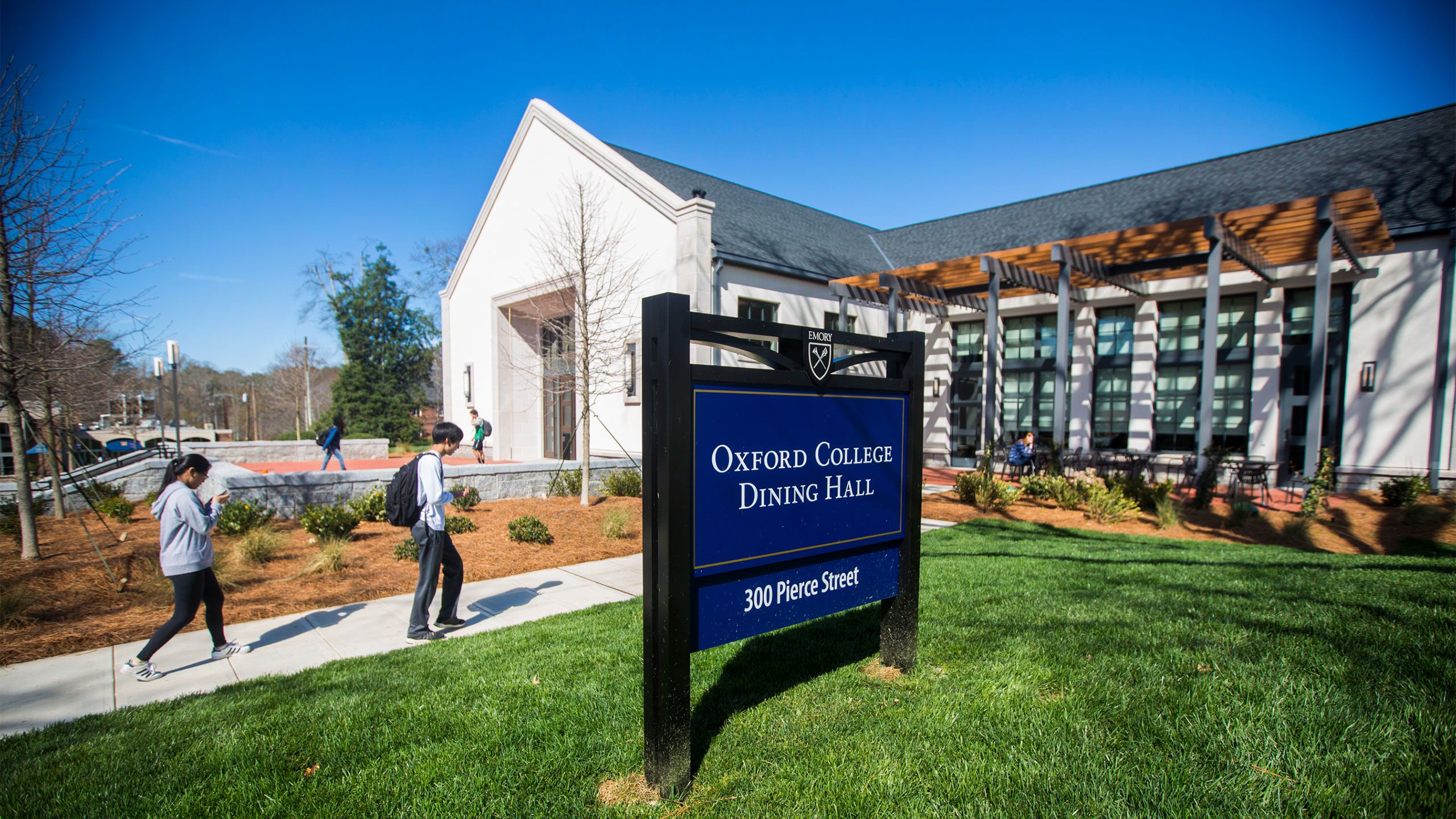 An exterior view of the Oxford Dining Hall with students walking in