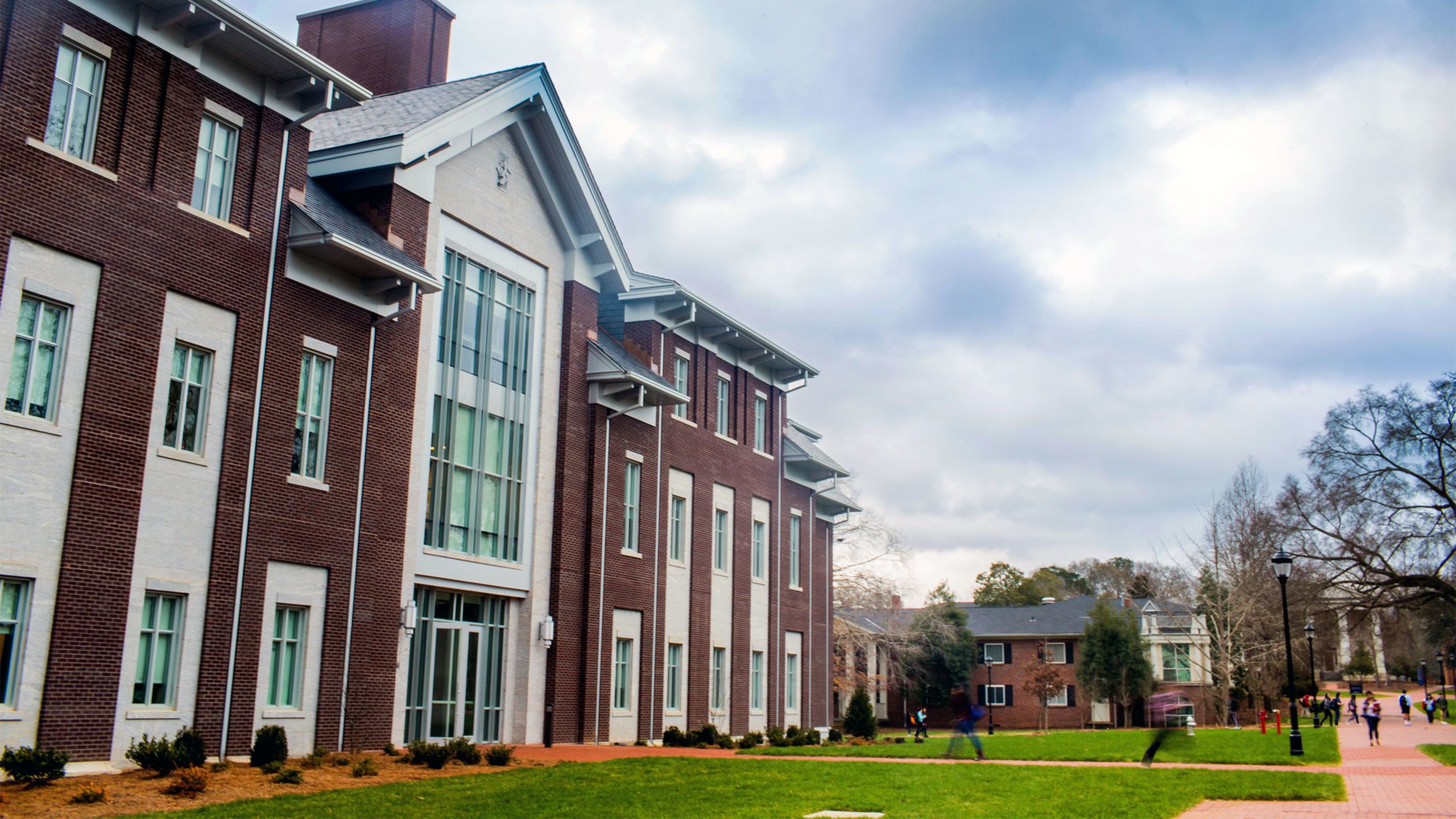 An exterior view of the Oxford Science Building, which features large windows and red brick