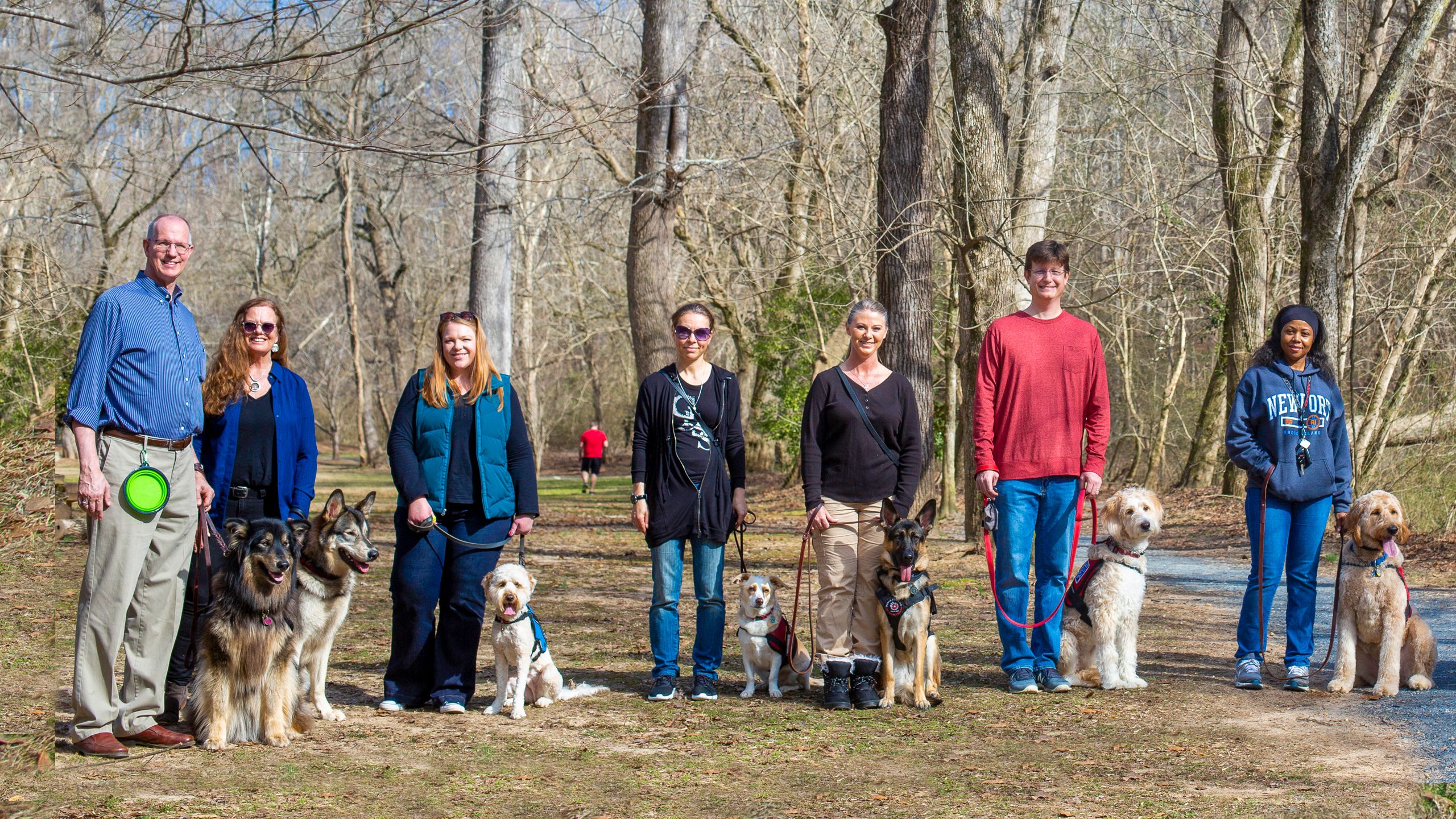 Portrait of Beowulf, Finn, owners, and other owners and therapy dogs