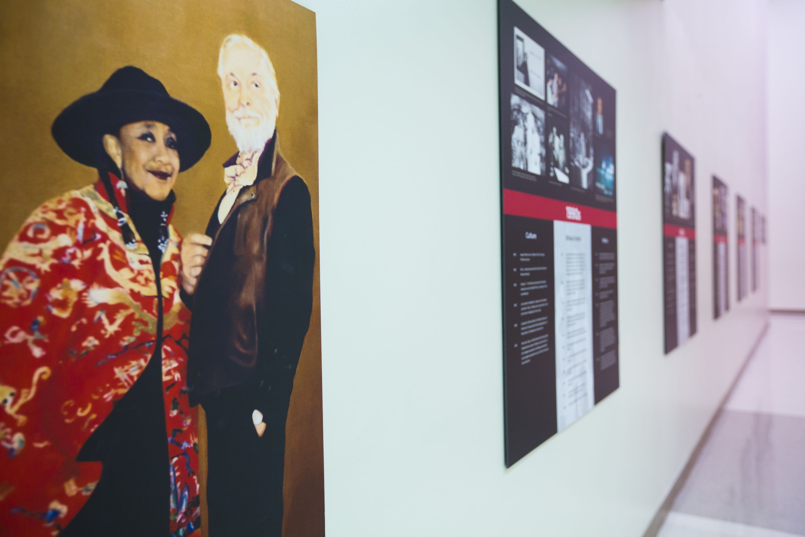 A close up of an exhibit poster showing Camille Billops and James V. Hatch