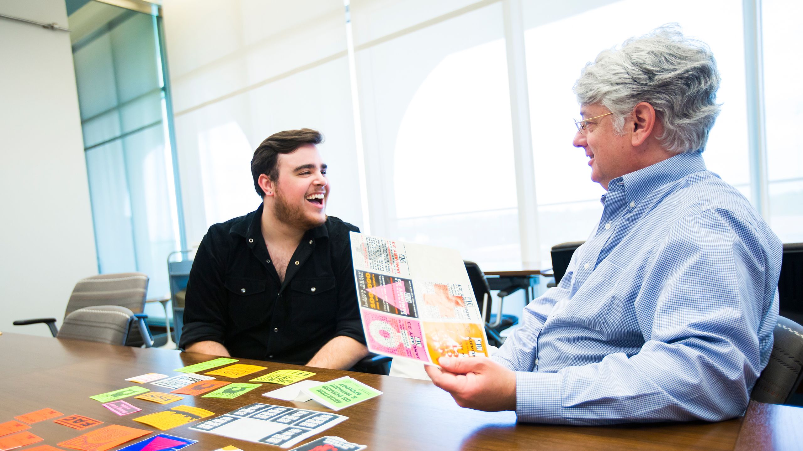 Paul talking with a professor