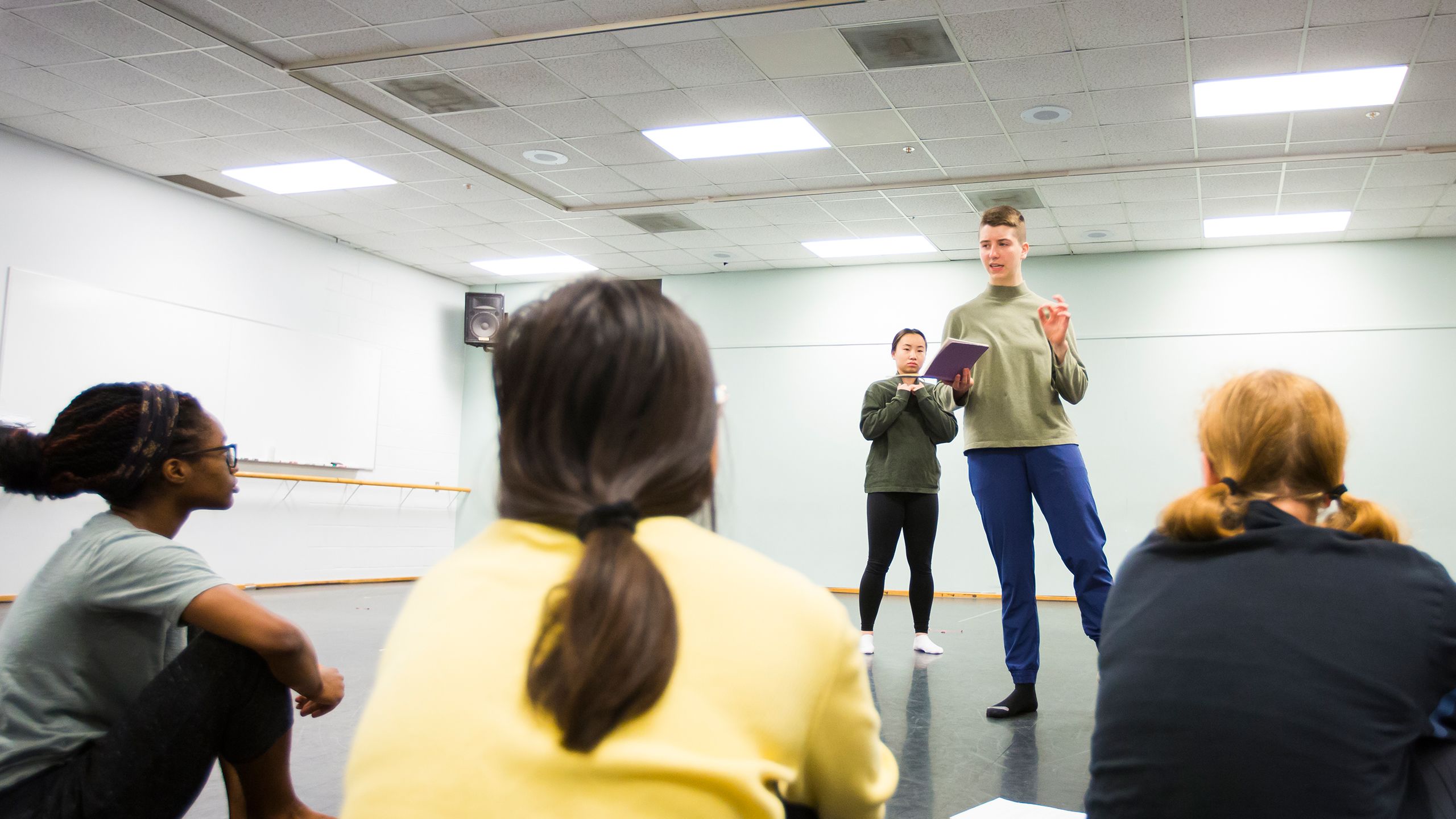 Laura Brigg giving the dance group instructions