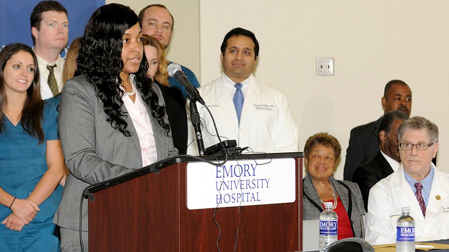 Amber Vinson at press conference podium