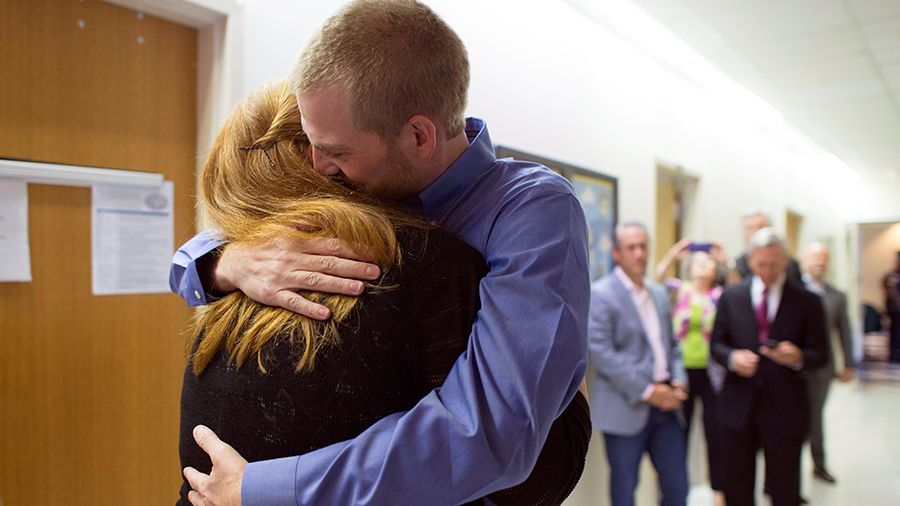 Kent Brantly embraces his wife Amber