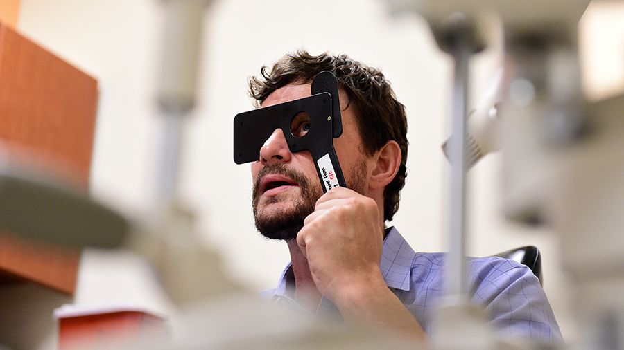 Dr Ian Croizer taking eye exam
