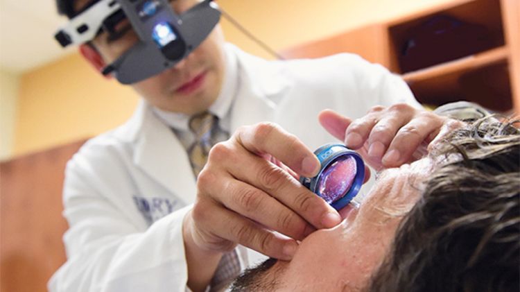Dr Yeh examines Dr. Crozier's eye