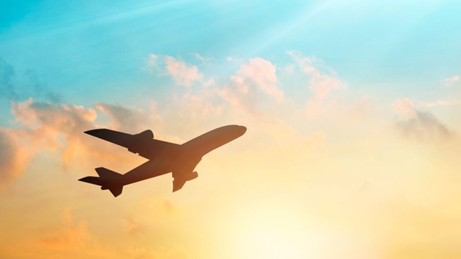 Airline plane in sunny sky