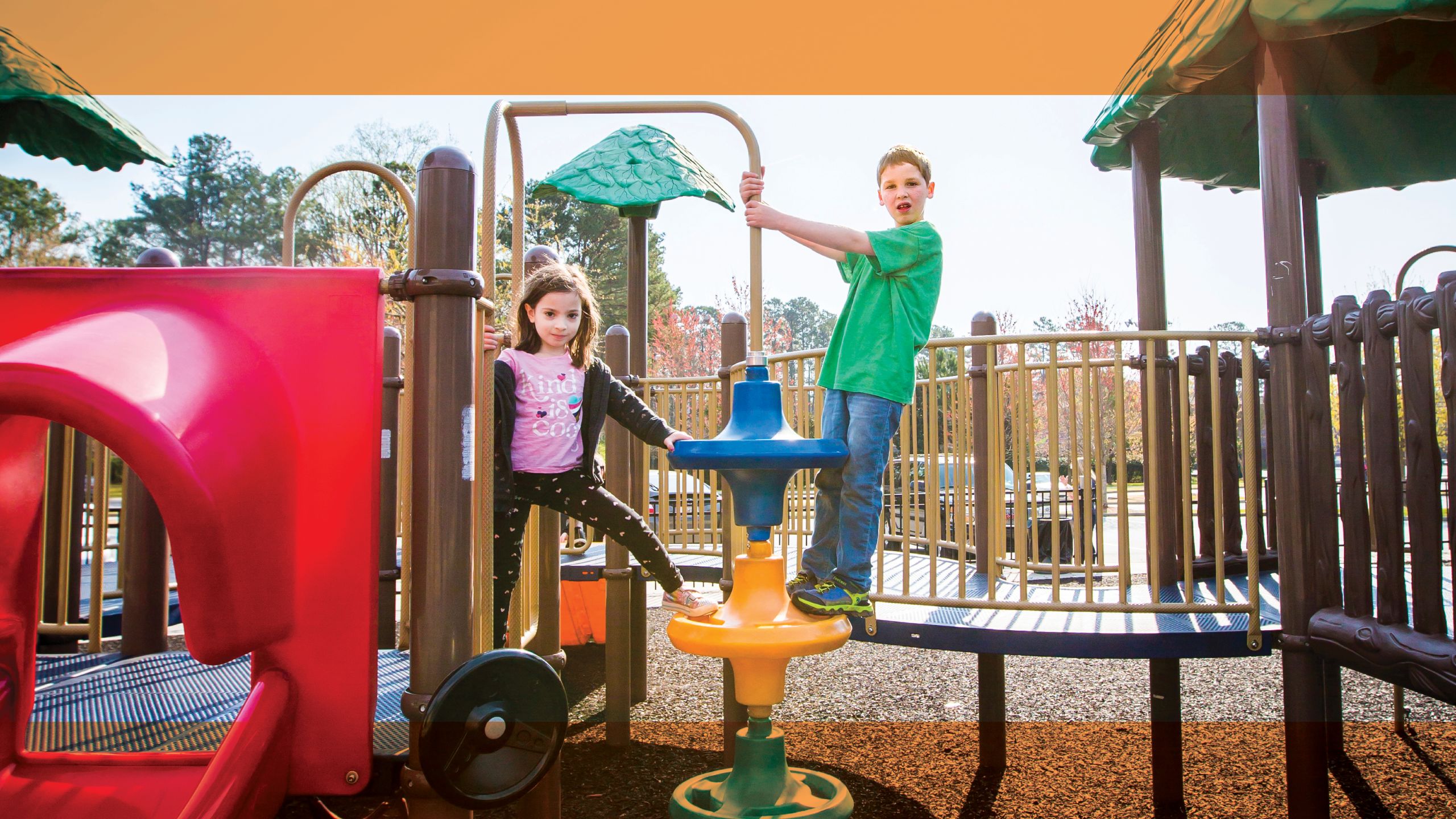 Elise and Amiel playing with each other at the park.